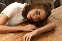 unknown person sitting indoors